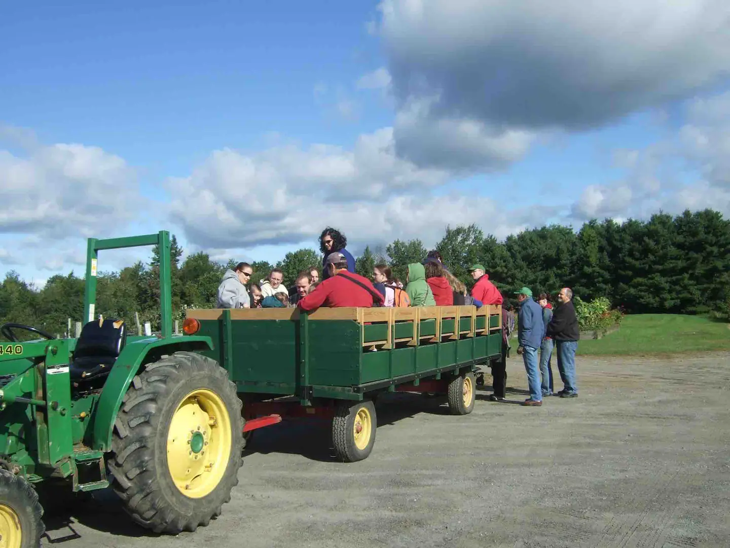 People enjoying a tractor ride at Alyson's Orchard